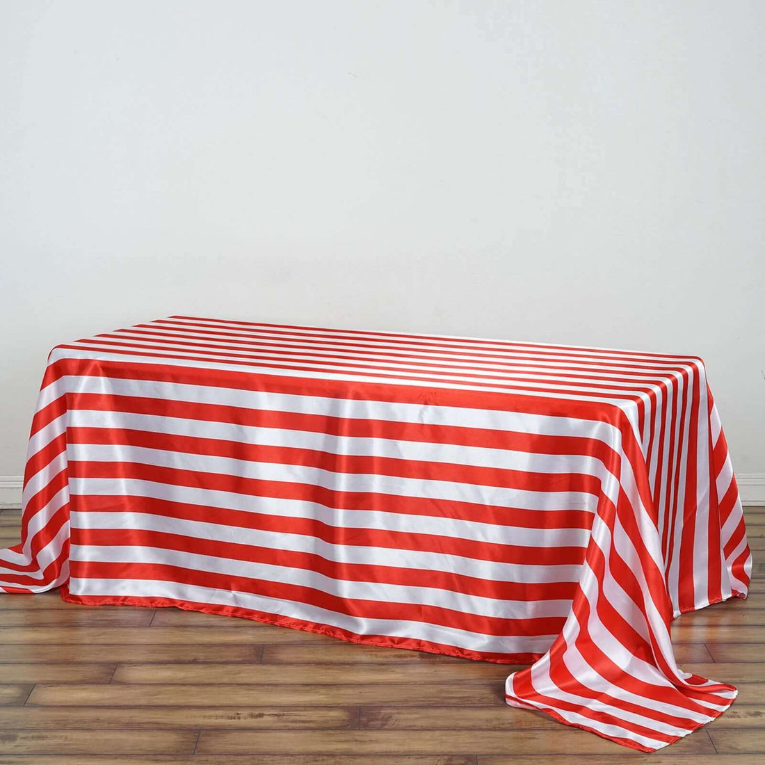 Red and white striped tablecloth on a wooden surface.