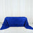 Blue rose-patterned tablecloth on a plain surface