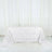 White rose-patterned tablecloth on a plain backdrop.