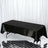 Black satin table cover draped over a rectangular table