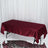 Burgundy satin tablecloth draped over a rectangular table