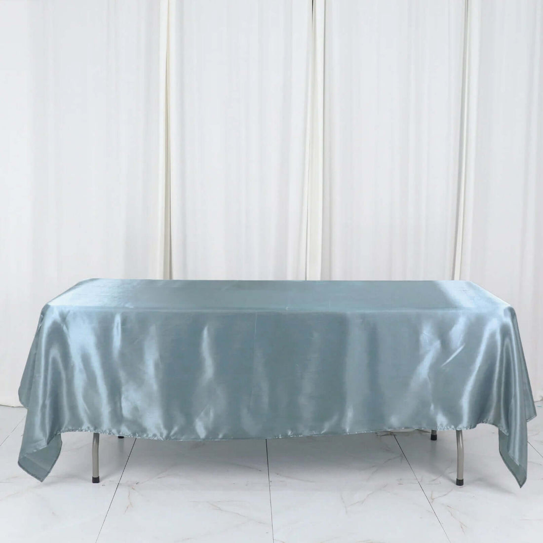 Light blue satin tablecloth on a table