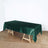 Green satin tablecloth on a wooden table in a studio setting.