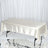 Silk tablecloth draped over a table on a reflective surface