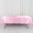 Pink satin tablecloth draped over a folding table