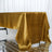 Gold satin tablecloth draped elegantly over a table.