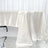 Ivory satin tablecloth draping elegantly over a table