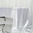 Shiny white tablecloth draped elegantly over a table