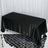 Black tablecloth on a rectangular table with a shiny finish.