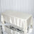 Elegant cream satin tablecloth on a rectangular table.