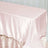 Pink satin tablecloth draped over a table for elegant events.