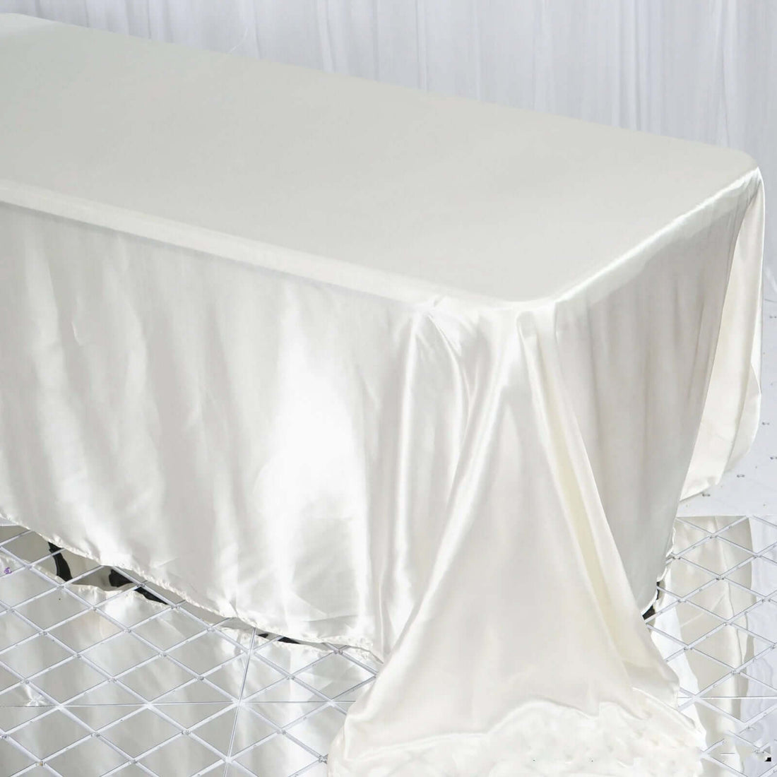 Satin tablecloth draped elegantly over a table.