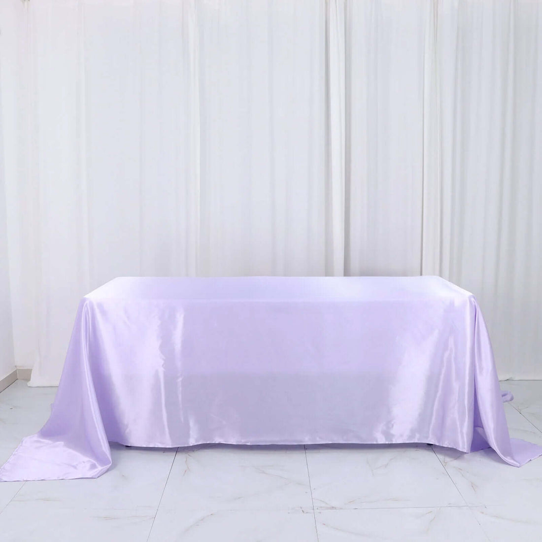 Lavender satin tablecloth draped elegantly on a table