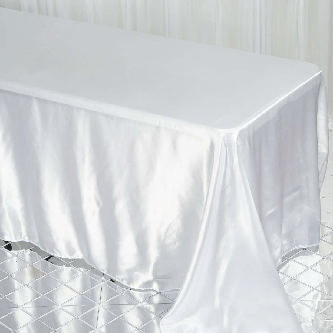 Sleek satin tablecloth draped elegantly over a table