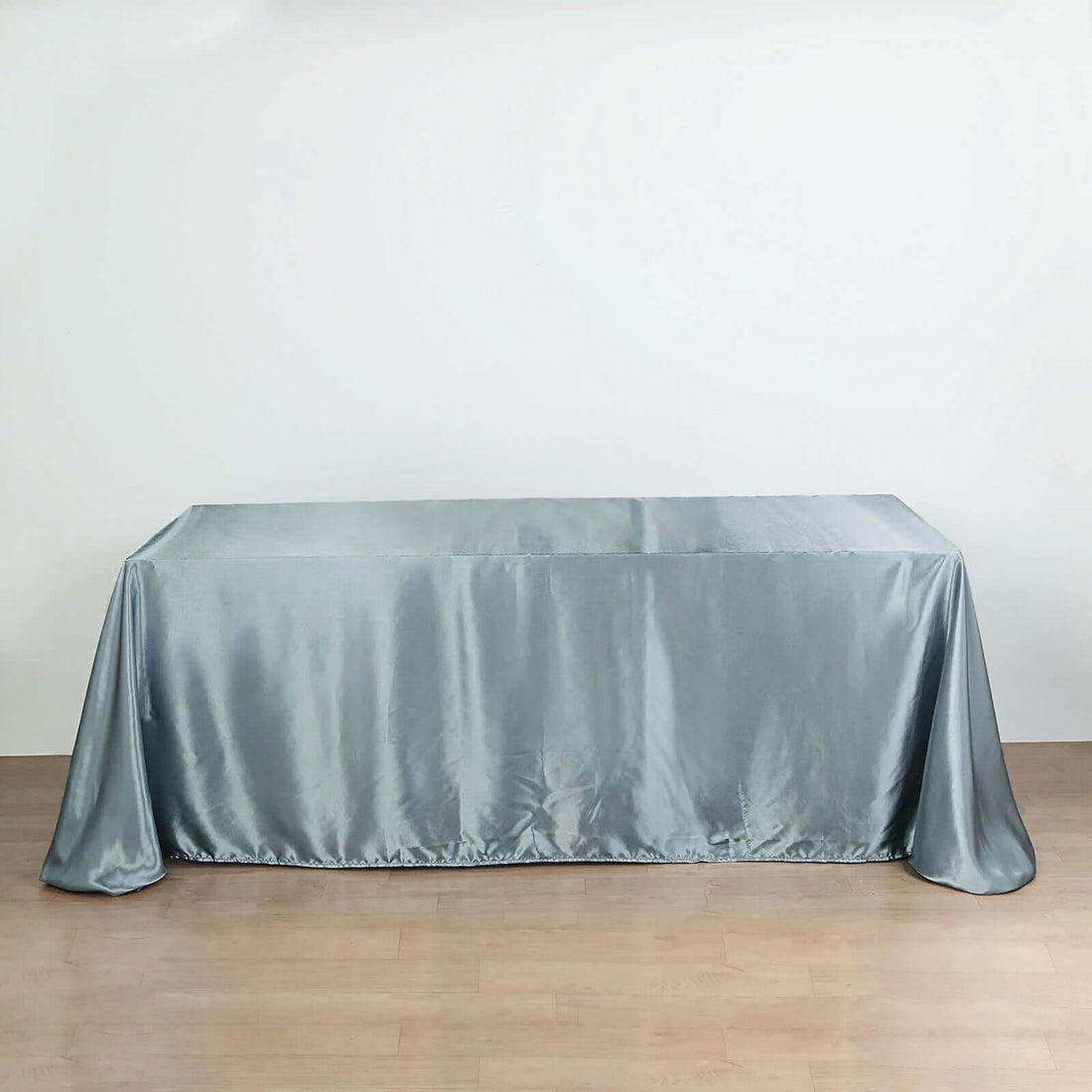 Gray satin tablecloth draped over a table