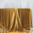 Gold satin tablecloth draped elegantly over a table.