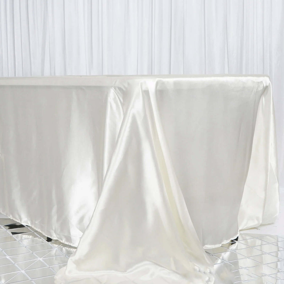 Satin tablecloth draping elegantly on a table