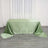 Green satin tablecloth draped elegantly on a table.