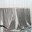 Silver satin tablecloth draped elegantly on a table.