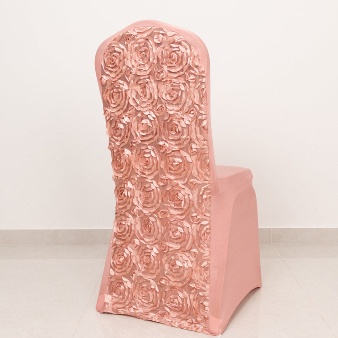Pink chair with rose design on the back, perfect for elegant decor.