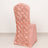 Pink chair with rose design on the back, perfect for elegant decor.