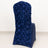 Navy blue rose-patterned chair cover on a plain backdrop.