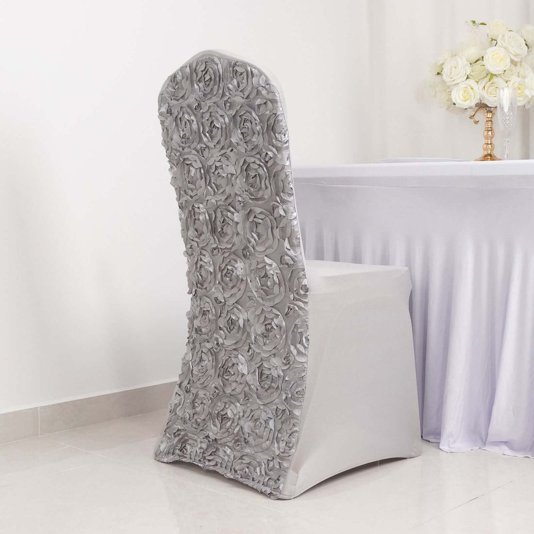 Elegant silver rose chair cover for weddings and events.