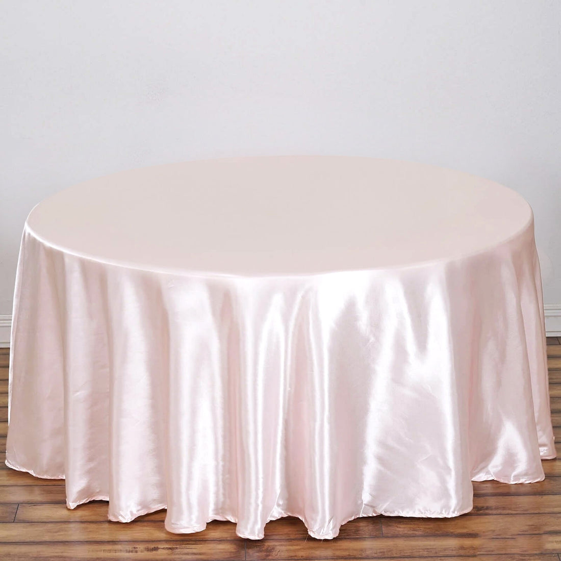 Round blush satin tablecloth for elegant event decor