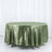 Green satin tablecloth draped elegantly over a round table.