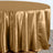 Gold satin tablecloth draping elegantly over a round table.