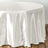 Elegant white satin tablecloth draping over a round table