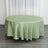 Round green tablecloth draped elegantly over a table.