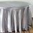 Silver satin tablecloth draping elegantly over a round table.