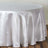 White satin tablecloth draping elegantly over a round table.
