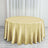 Gold tablecloth draped over a round table in a bright setting.
