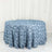 Blue rose-patterned tablecloth on a round table.
