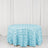 Light blue rose-patterned tablecloth on a round table