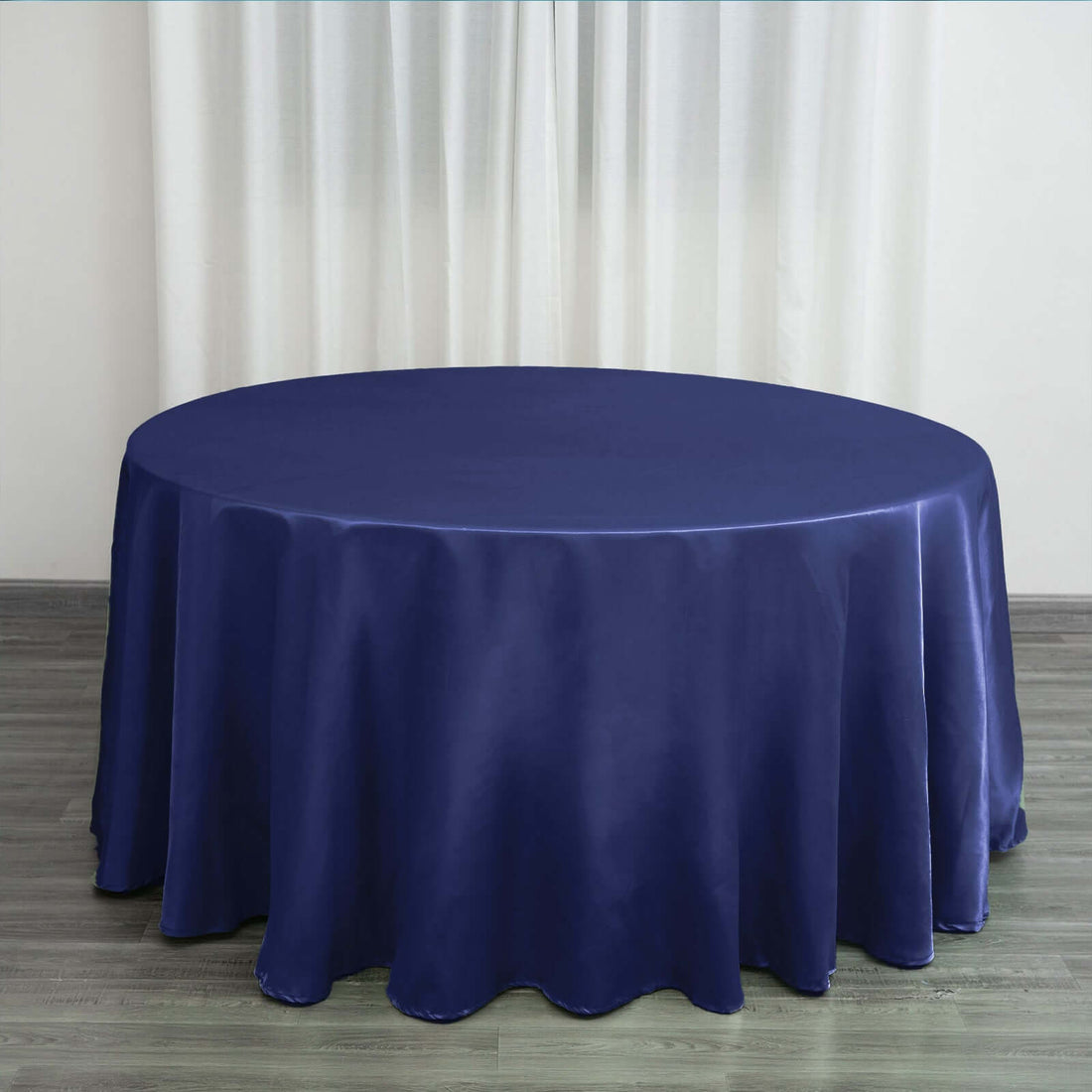 Round navy blue tablecloth draped elegantly on a table.