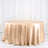 Round satin tablecloth in champagne color, draping elegantly.
