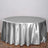Silver satin round tablecloth on a wooden floor.