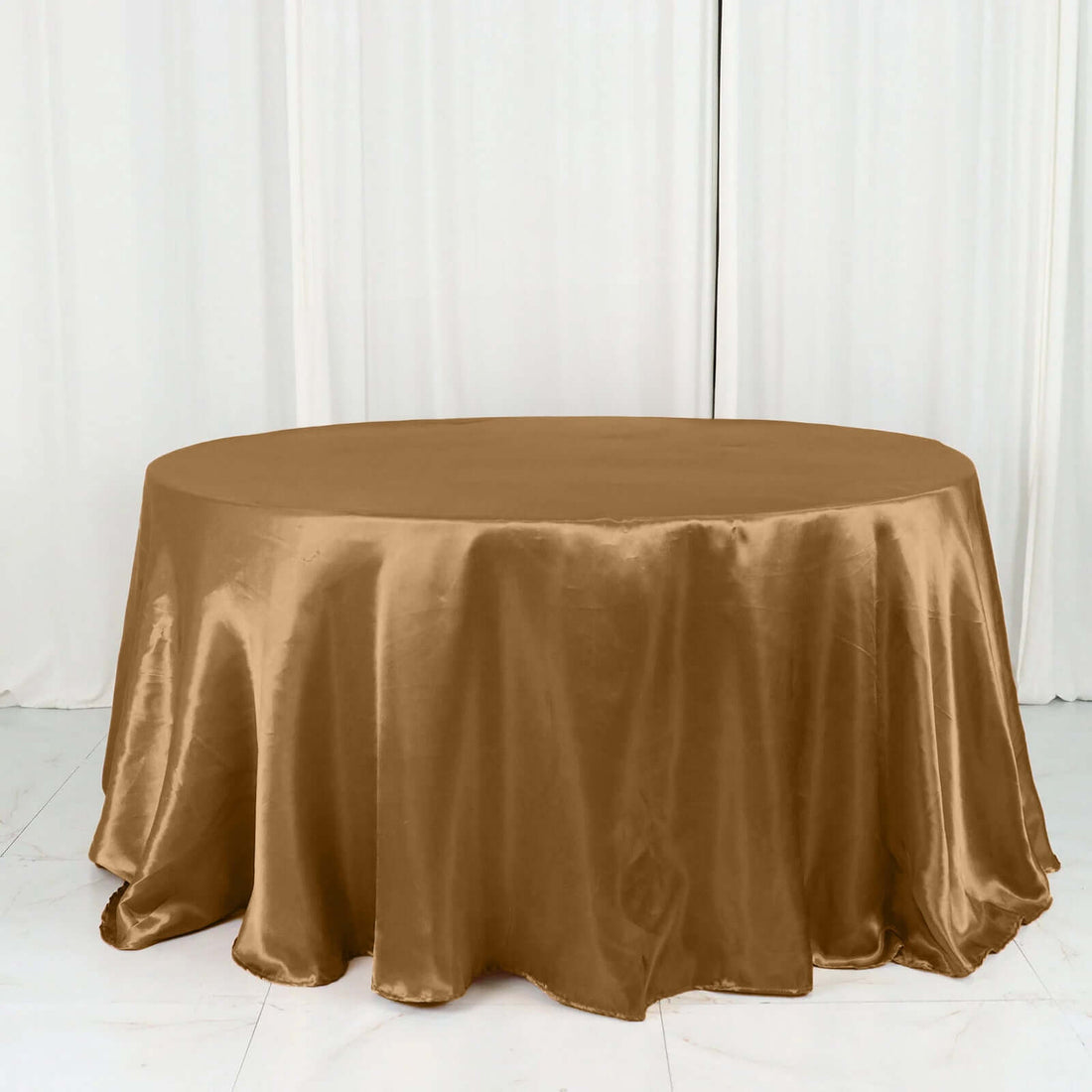 Brown satin tablecloth draped over a round table
