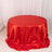 Red round tablecloth with elegant draping and a glossy finish.