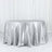 Silver tablecloth draped elegantly over a round table