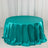 Teal satin tablecloth draped elegantly over a round table.
