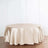 Beige round tablecloth on a wooden table.