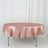 Round satin tablecloth in soft pink on a white backdrop.