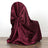 Burgundy satin chair cover draped elegantly over a chair