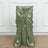 Green satin chair cover with tied bow detail on a plain background.