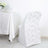 White chair with rose-patterned backrest in a dining setting.