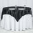 Black satin tablecloth draped elegantly over a round table with plates and glasses.